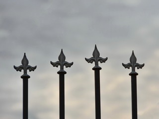 Iron fence details with sky background