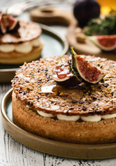 Tarte on sand base with fresh figs, almonds and crispy waffle with almonds and cocoa powder. Fresh Homemade Fruit Tart with berries