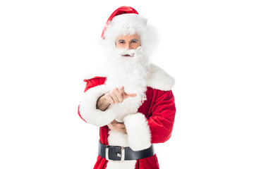 cheerful santa claus pointing at camera by finger isolated on white background