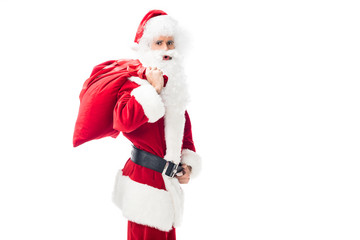 shocked santa claus holding christmas sack over shoulder isolated on white background