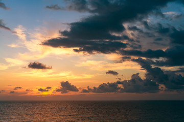 cloudy sky over the sea on a red orange sunset