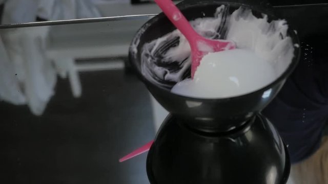 process of mixing of components for reception without an aldehyde paint in a beauty salon. slow motion
