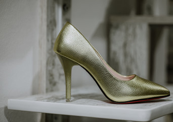 Golden heels in studio. Fashion