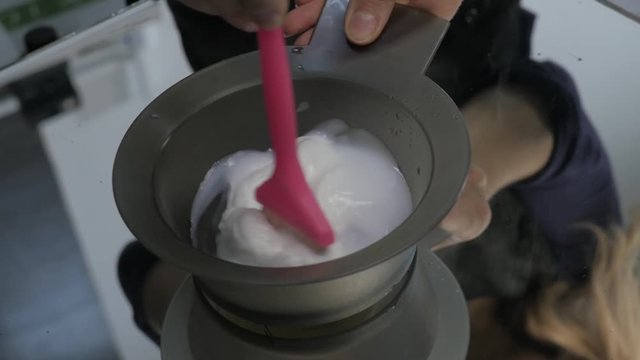 process of mixing of components for reception without an aldehyde paint in a beauty salon. slow motion