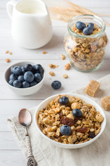 Oat flakes, granules and nuts muesli with blueberries. The concept of healthy food, Breakfast.