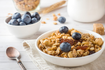 Oat flakes, granules and nuts muesli with blueberries. The concept of healthy food, Breakfast.