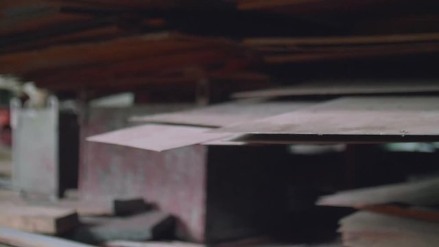 Defocused vire of metal components in old workshop