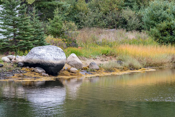Fototapeta na wymiar boulder on rivers edge