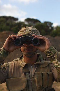 Military Soldier Looking Through Binoculars