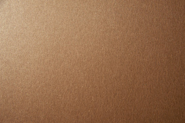 Texture of brown glitter paper background. Macro photo