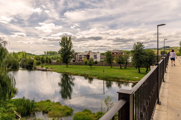 Fototapeta premium Serene landscape and reflections in water on Cua river in Cacabelos, in the Bierzo region of Spain.