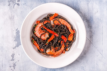 Black spaghetti with prawns and vegetables