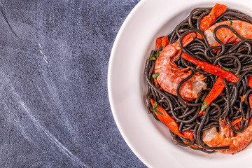Black spaghetti with prawns and vegetables