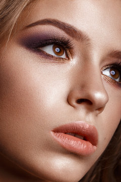 Beautiful girl with creative colorful make up. Beauty face. Photos shot in studio
