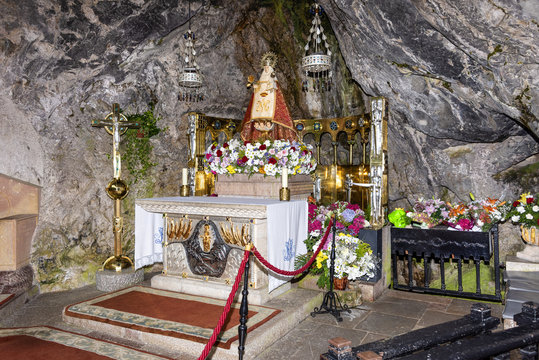 Spain, Asturias, Picos de Europa, Covadonga: Detail of Virgin Mary shrine in the Hermitage of The Holy Cave of Covadonga (Santa Cueva) a famous Spanish sanctuary - concept religion pilgrimage travel