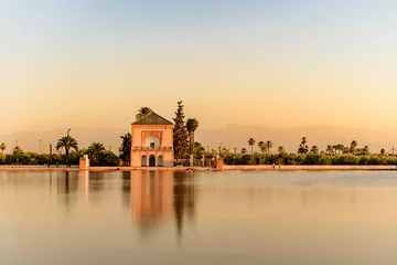 Papier Peint photo Lavable Maroc The Menara gardens are botanical gardens located to the west of Marrakech, Morocco, near the Atlas Mountains.