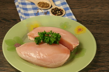 Raw chicken breast and spices close up. Selective focus