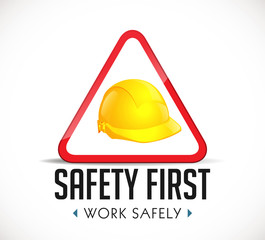 Safety first concept - work safely sign yellow helmet as warning sign
