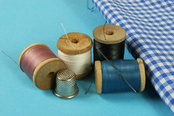 wooden spools with colored cotton threads for sewing, vintage