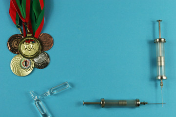 Concept of doping in sport - deprivation medals top view. Place for your text.
