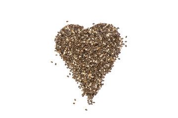 Lot of whole fresh mottled chia seeds heart flatlay isolated on white background