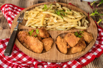 Chicken nuggets with yellow beans.