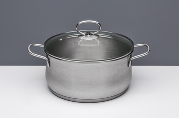 New kitchen pot for cooking soup with lid, isolated.