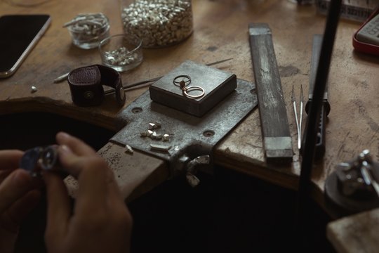 Jewelry designer working in workshop