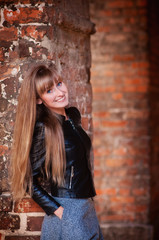 Fototapeta premium Portrait of a beautiful, dreamy and sad girl with long hair autumn