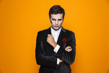 Handsome man zombie looking camera seriously isolated