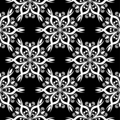 White flowers on black background. Ornamental seamless pattern