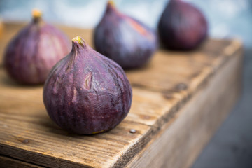 Fresh ripe figs on the rustic background. Selective focus. Shallow depth of field.