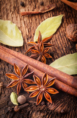 Different spices, Cinnamon, anise on wooden old table