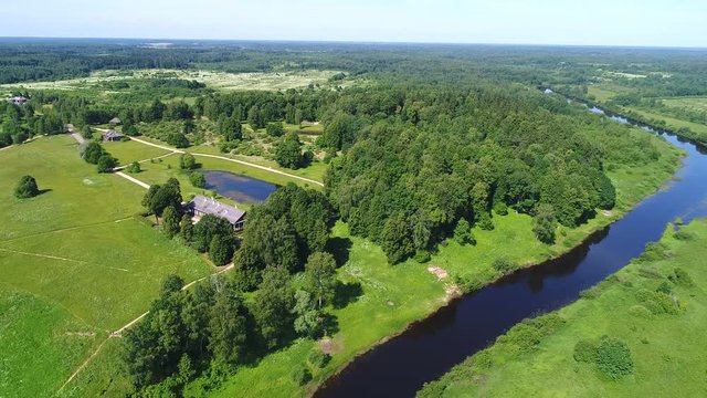 View at Trigorskoe and the river Sorot (aerial video). Pushkin Mountains, Russia