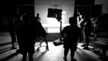 Blurry images of making video production shooting studio in silhouette which have professional...