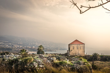 Amazing landscape view of Byblos, traditional house, rocks, palms trees, mountains in the...