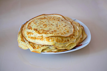 Pancake with chia or poppy seeds on the plate. Shrovetide.