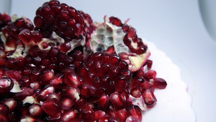 pomegranate seeds on a white background
