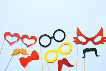 Colorful props for party. Carnival accessories set. Paper glasses, hat, lips, moustaches, tie on...