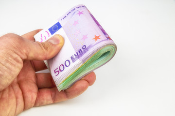 Euro money roll in hand