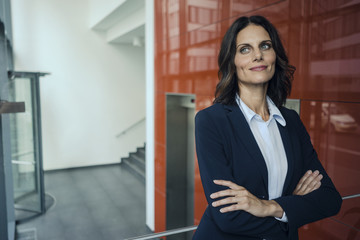 Portrait of a successful businesswoman, with arms crossed