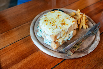 Baked bread spinach with cheese with french-fries