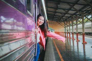 Beautiful women waving through the door.