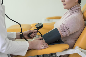 Doctor Measuring Blood Pressure