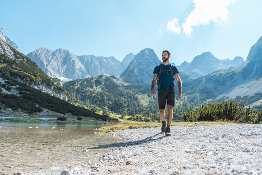 Austria, Tyrol, Man hiking at Seebensee Lake