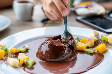 Spoon scooping chocolate cocoa dome dessert