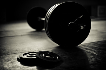 Fototapeta na wymiar Barbell and discs in a weightlifting gym