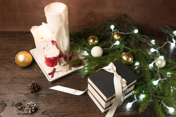 Christmas background with decorations and gift boxes on wooden board