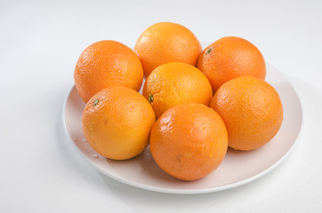 Orange on a white plate