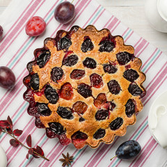 Plum pie on a light background.